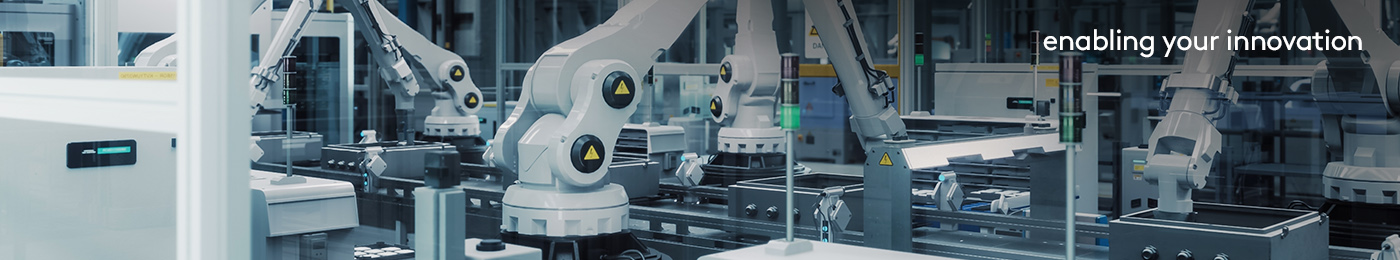 Tech Factory with White Robotic Arms Assembling Electronic Comp