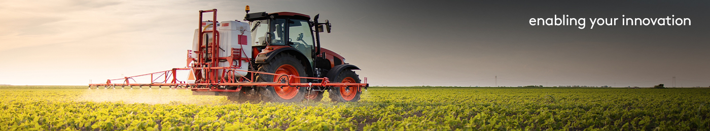 Tractor in a green field