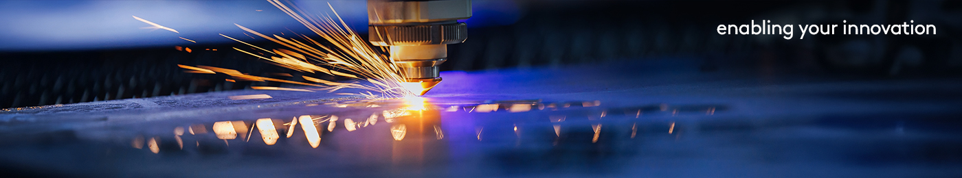 Blue color Laser CNC cut of metal with light spark, technology