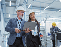 engineer in factory holding tablet