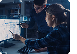 engineers working together in front of computer