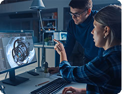 gineer Working on Desktop Computer, Screen Showing CAD